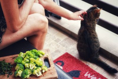 Midsection of woman preparing food on table