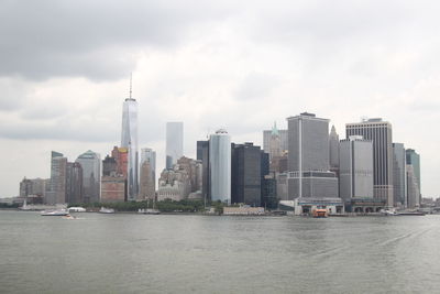 City skyline against cloudy sky