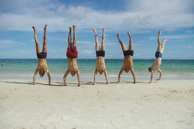 View of beach against cloudy sky