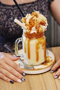 Midsection of woman holding ice cream