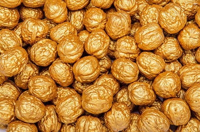 A bunch of brown golden walnuts