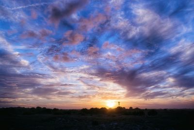 Scenic view of landscape against cloudy sky