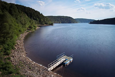 High angle view of dam by river against sky