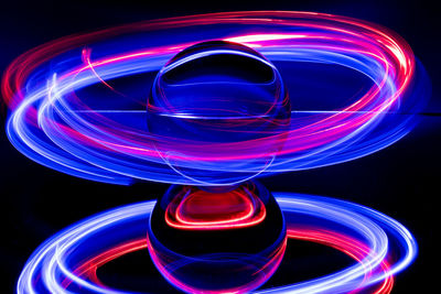 Close-up of light painting against black background