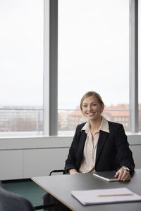 Businesswoman working in boardroom