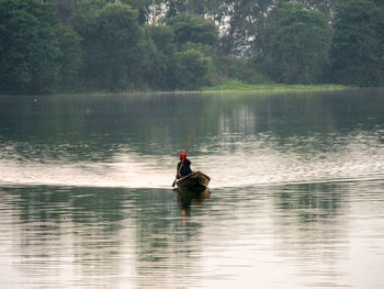 Man in boat on lake