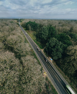 High angle view of railroad tracks by road against sky