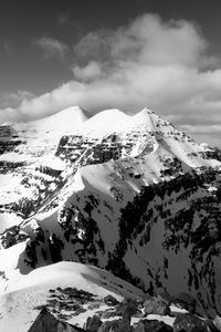 Scenic view of snow covered mountains against sky