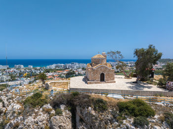 View of townscape against clear blue sky