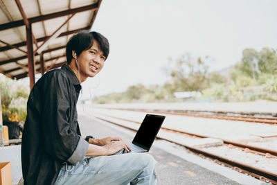 Young man using mobile phone