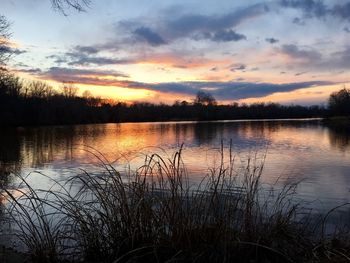 Scenic view of lake against sky during sunset