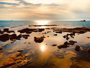 Scenic view of sea against sky during sunset