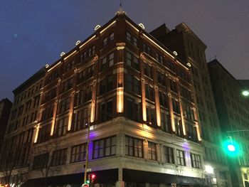 Low angle view of building against sky at night