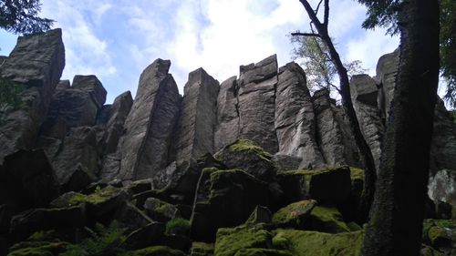 Low angle view of rocks against sky