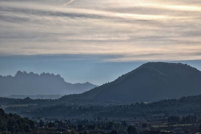 Scenic view of mountains against sky during sunset