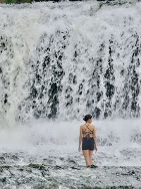 Rear view of woman in sea