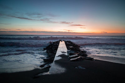 Scenic view of sea against sky during sunset