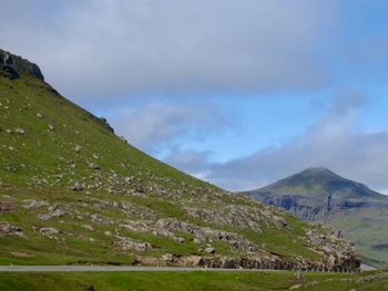 Scenic view of landscape and mountains against sky