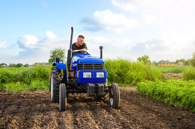 Scenic view of agricultural field against sky