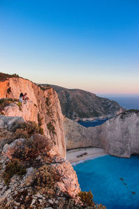 Scenic view of rock formation against sky in navagio beach