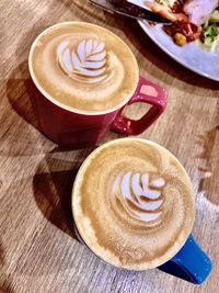 High angle view of cappuccino on table