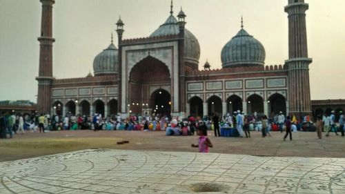 Group of people in front of historical building