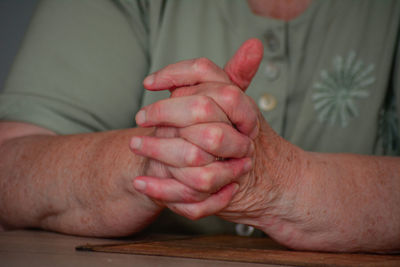 Close-up of man hands on table