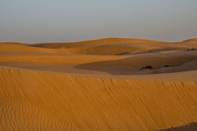 Scenic view of desert against clear sky