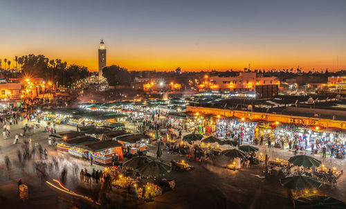 High angle view of city lit up at night