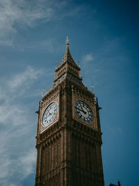 Low angle view of clock tower against sky