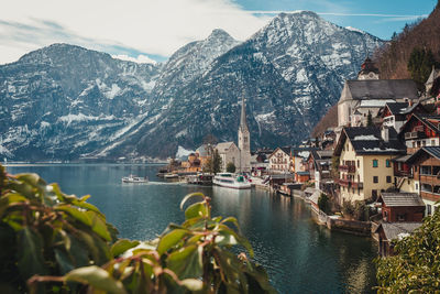 Panoramic view of buildings and mountains against sky