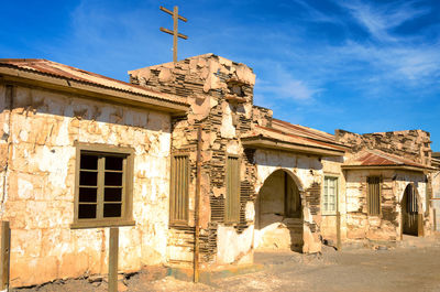 Low angle view of old temple against sky