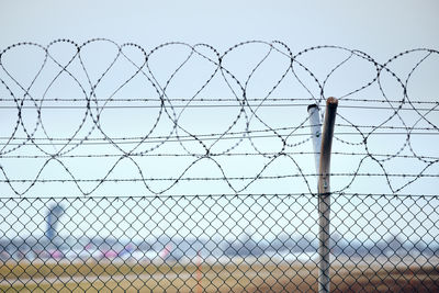 Chainlink fence against clear sky