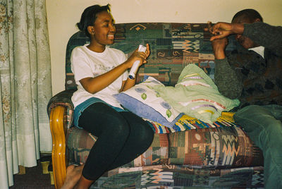 Young man sitting on seat