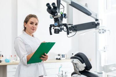 Female doctor examining x-ray at laboratory