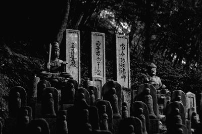 Low angle view of statues at cemetery