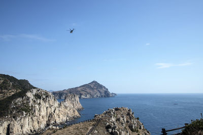 Scenic view of sea against blue sky