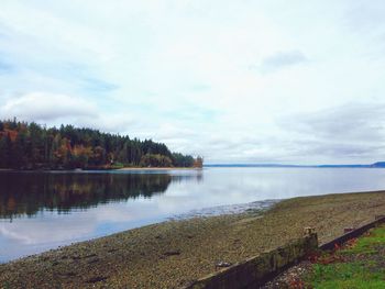 View of calm sea against cloudy sky