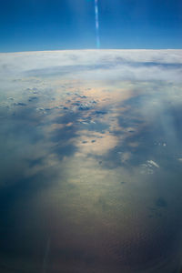 Aerial view of clouds in sky during sunset