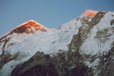 Scenic view of snowcapped mountains against clear sky