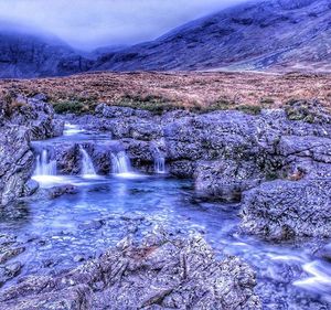 Scenic view of river and mountains