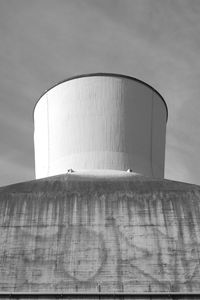 Low angle view of factory against sky