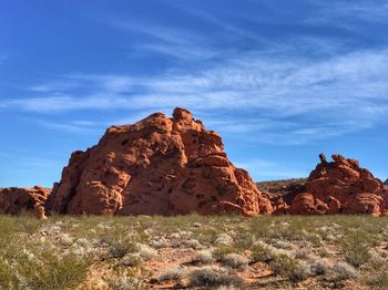 Rock formations on landscape against sky