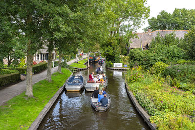 Giethoorn, netherlands - 13 september 2020. tourists sailing on rented boats on the canal.