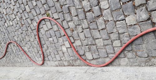 Close-up of cables on tiled floor