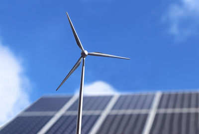 Low angle view of wind turbine against sky