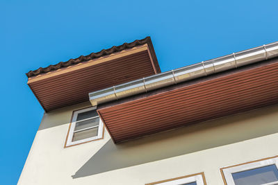 Low angle view of building against blue sky