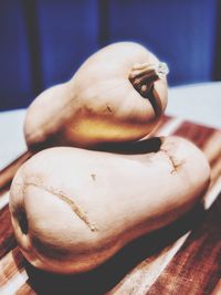 Close-up of hand holding ice cream on table