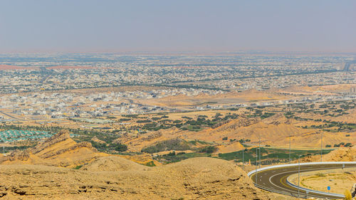 High angle view of road amidst desert against sky