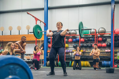 Side view of man exercising in gym